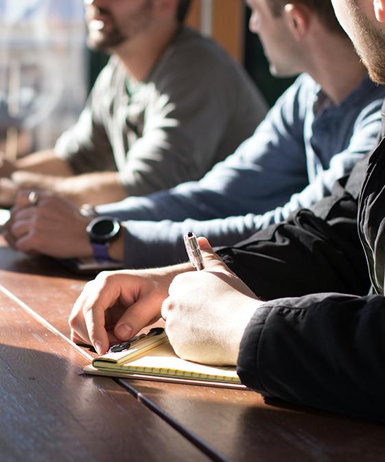 People at a table meeting.